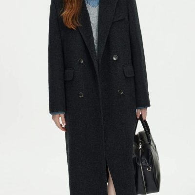 Elegant black wool coat with double-breasted buttons, perfect for fall and winter fashion, showcased in the Monalisa Store collection.