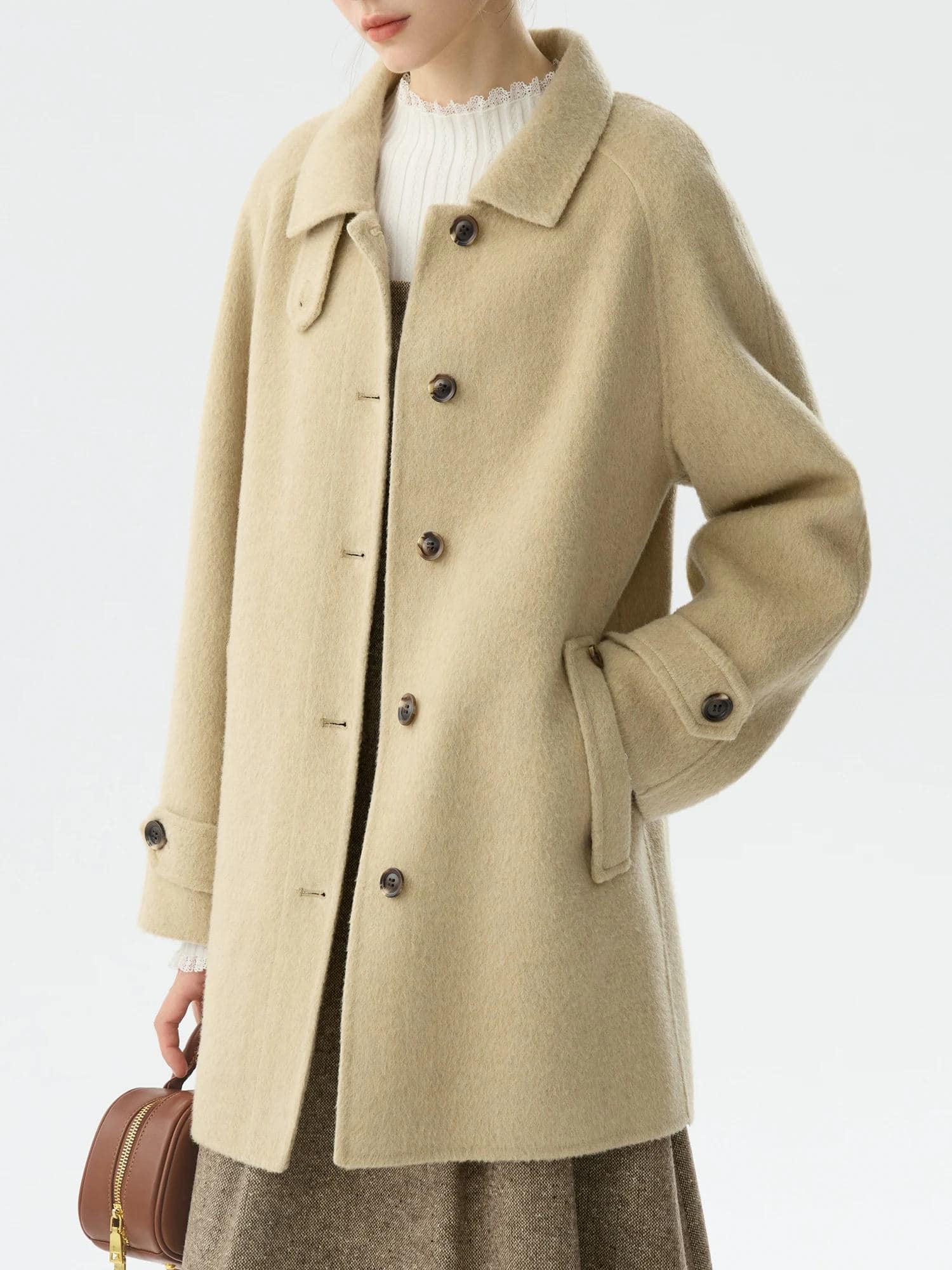 Light beige wool coat from Monalisa Store, perfect for stylish winter wear with oversized design and classic button details. Elevate your fashion with this cozy, elegant outerwear.