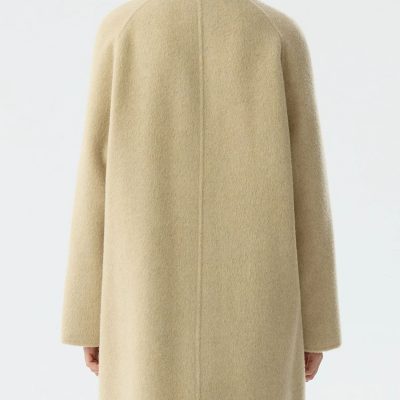 Cozy beige wool coat from Monalisa Medical Store, perfect for stylish cold-weather wear and eye care enthusiasts.