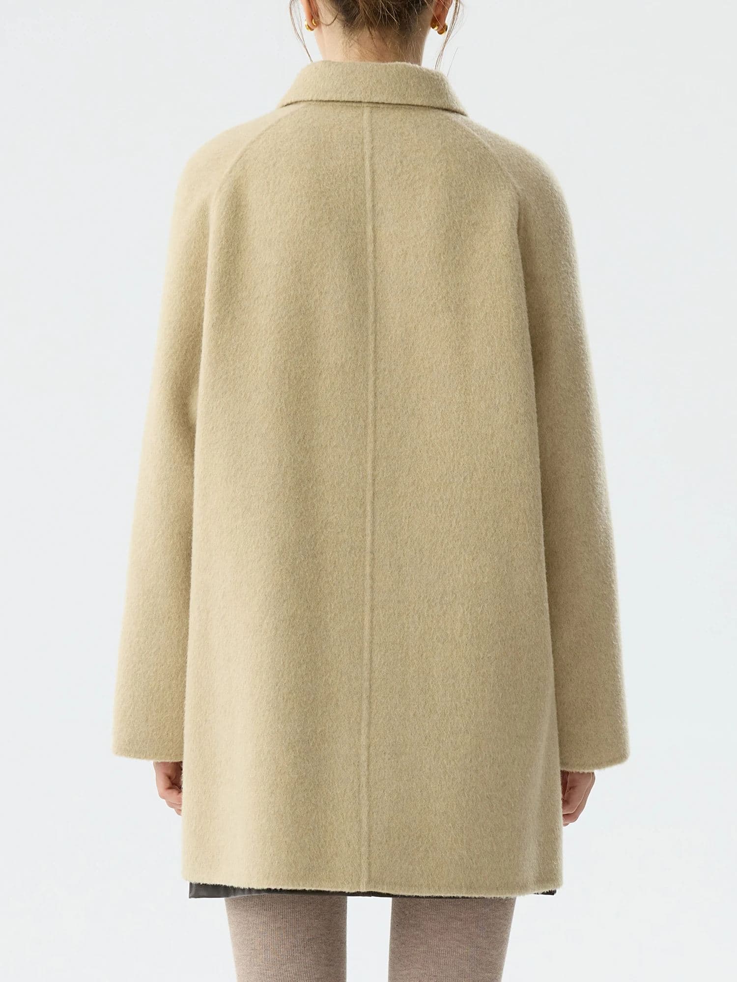 Cozy beige wool coat from Monalisa Medical Store, perfect for stylish cold-weather wear and eye care enthusiasts.