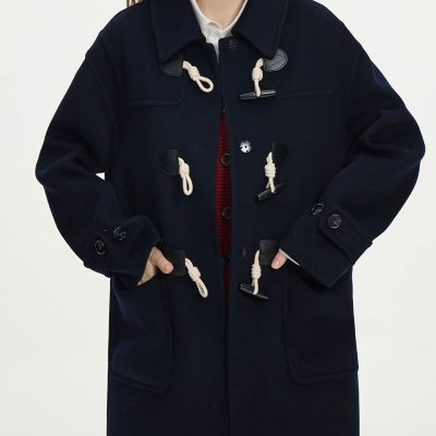 Warm navy duffle coat with toggle closures, perfect for winter fashion and casual wear.