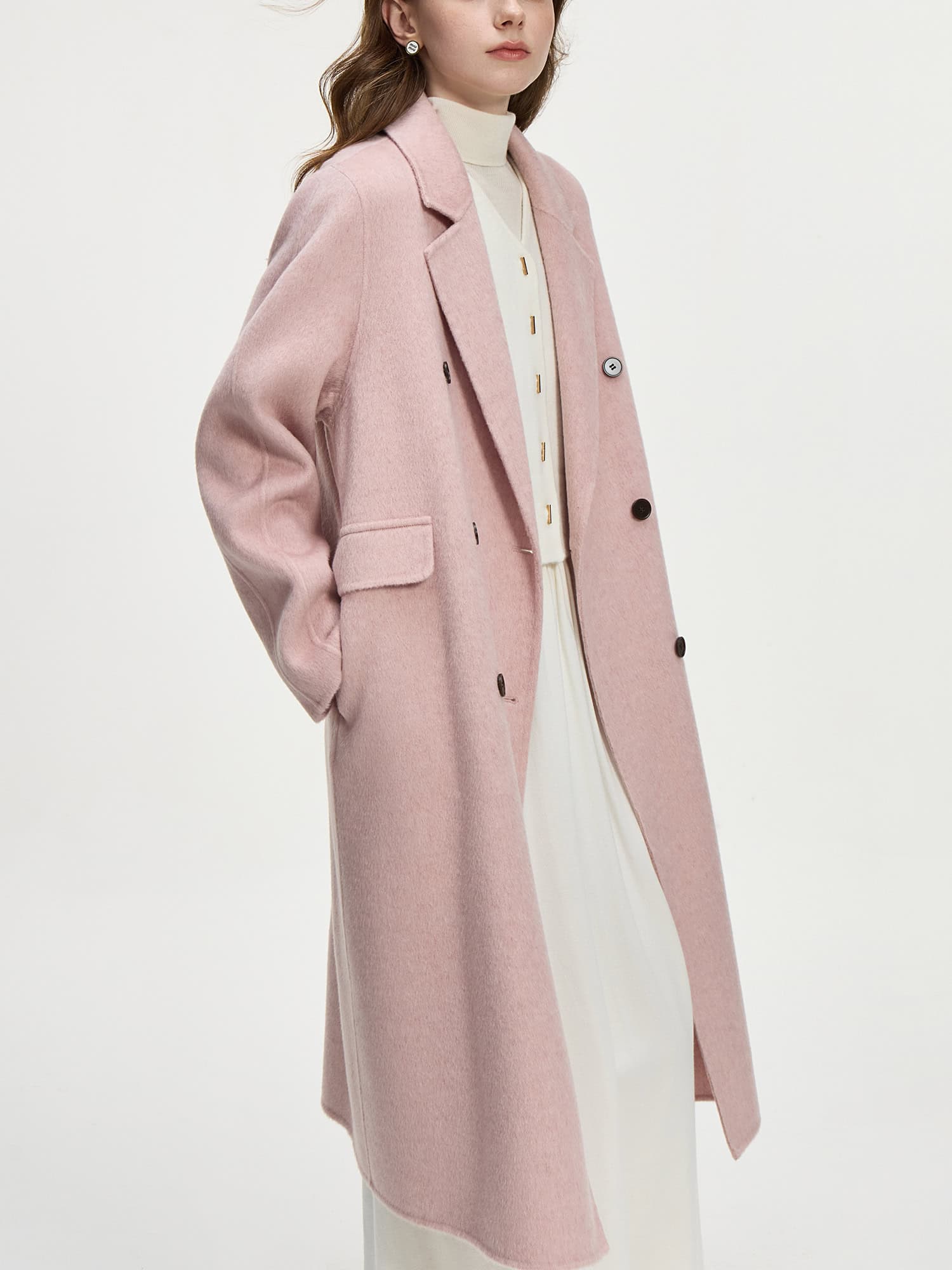 Luxurious pink wool coat with tailored lapels and button details, perfect for winter fashion or casual chic. Ideal for trendy, elegant, and warm outerwear choices.