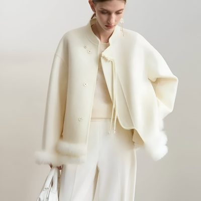 Elegant white fashion outfit featuring a luxurious fur-trimmed jacket and matching wide-leg pants, perfect for stylish and sophisticated look at Monalisa Store, ideal for modern fashion enthusiasts.