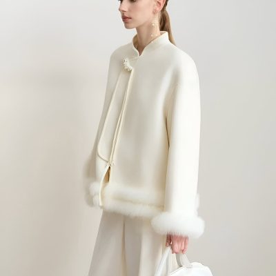 Elegant white jacket with fur trim, designed for luxurious fashion and style. Perfect for sophistication, featuring high-quality fabric and refined details. Ideal for upscale fashion enthusiasts.