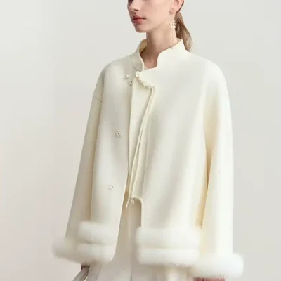 Luxurious white fur-trimmed coat showcasing high-end fashion and elegance, perfect for winter wear.