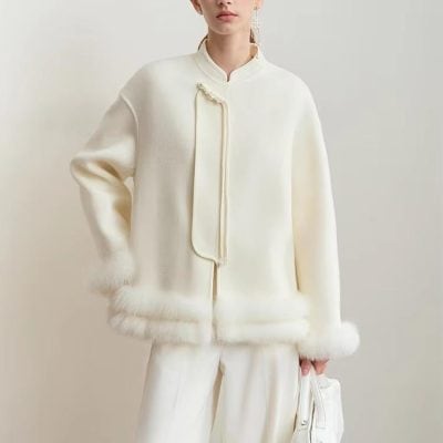 Luxurious white wool coat with pearl button details, designed for elegant winter fashion at Monalisa Store. Perfect for sophisticated looks and cold weather comfort.