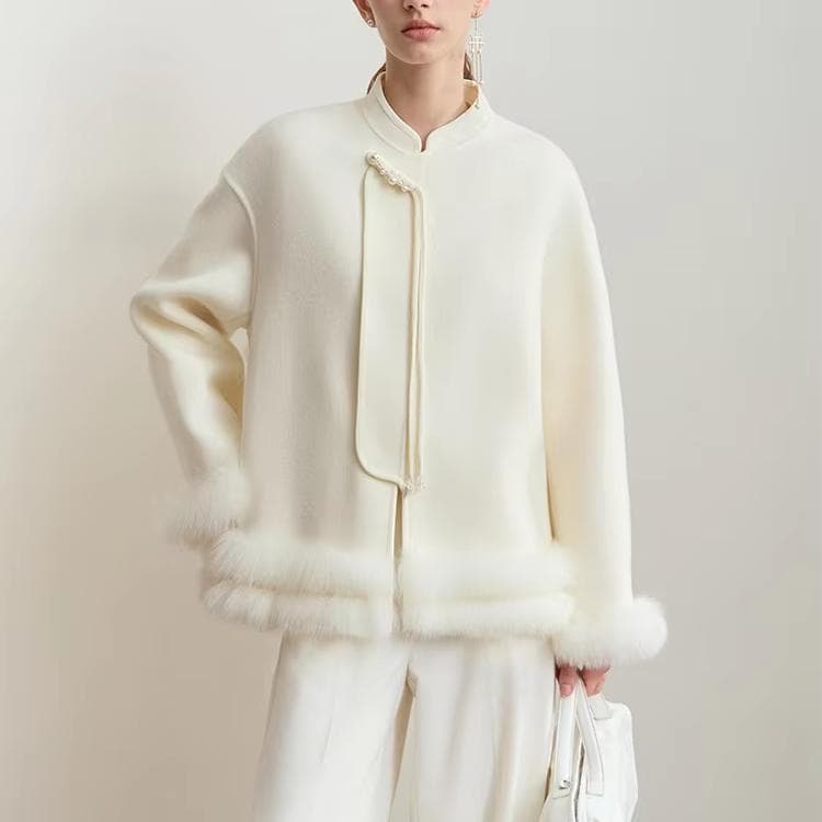 Luxurious white wool coat with pearl button details, designed for elegant winter fashion at Monalisa Store. Perfect for sophisticated looks and cold weather comfort.