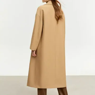 Long camel-colored women's coat with a classic design, perfect for winter fashion and style.