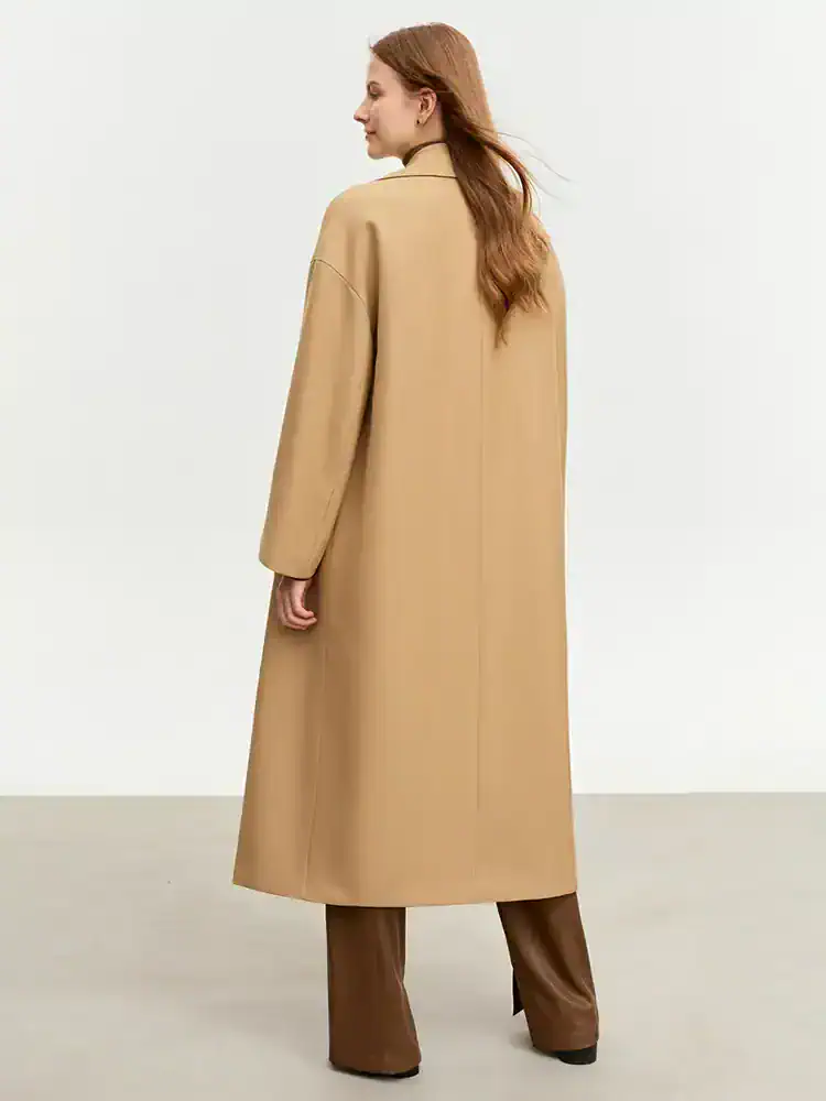 Long camel-colored women's coat with a classic design, perfect for winter fashion and style.