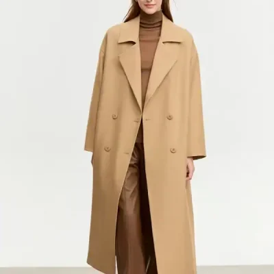 Elegant beige long coat with a classic lapel collar and double-breasted design, perfect for women seeking stylish winter outerwear for professional or casual wear.