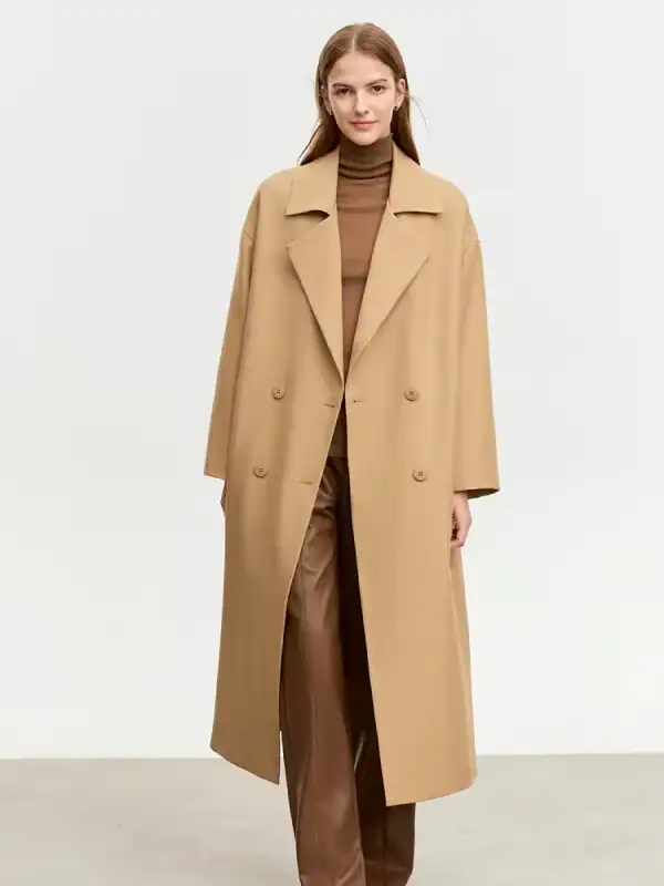 Elegant beige long coat with a classic lapel collar and double-breasted design, perfect for women seeking stylish winter outerwear for professional or casual wear.