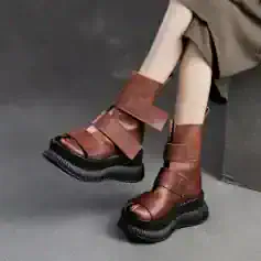 Brown leather platform ankle boots with thick black soles for stylish women at Monalisa Medical Store.