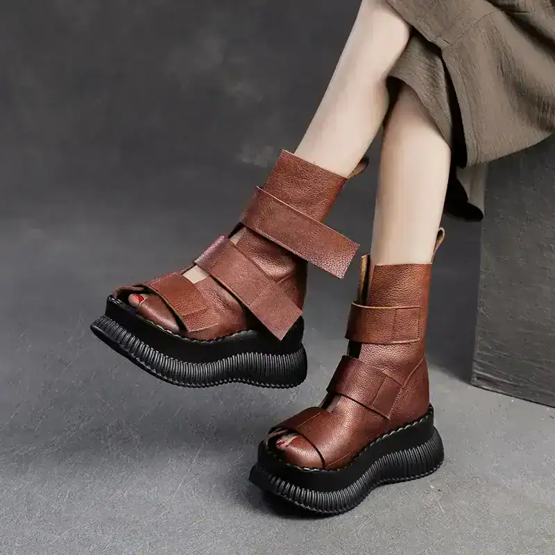 Brown leather platform ankle boots with thick black soles for stylish women at Monalisa Medical Store.