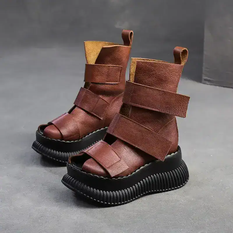 Leather chunky platform boots with wide straps and open toes, stylish footwear for fashion-forward individuals. Perfect for trendy outfits and bold fashion statements.