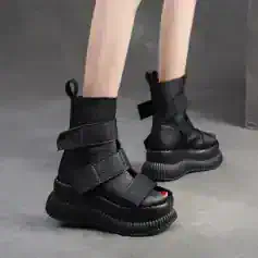 Black futuristic chunky platform boots with velcro straps and textured leather, stylish modern footwear for women and men, Monalisa Store fashion collection.