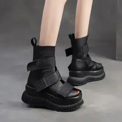 Black futuristic chunky platform boots with velcro straps and textured leather, stylish modern footwear for women and men, Monalisa Store fashion collection.