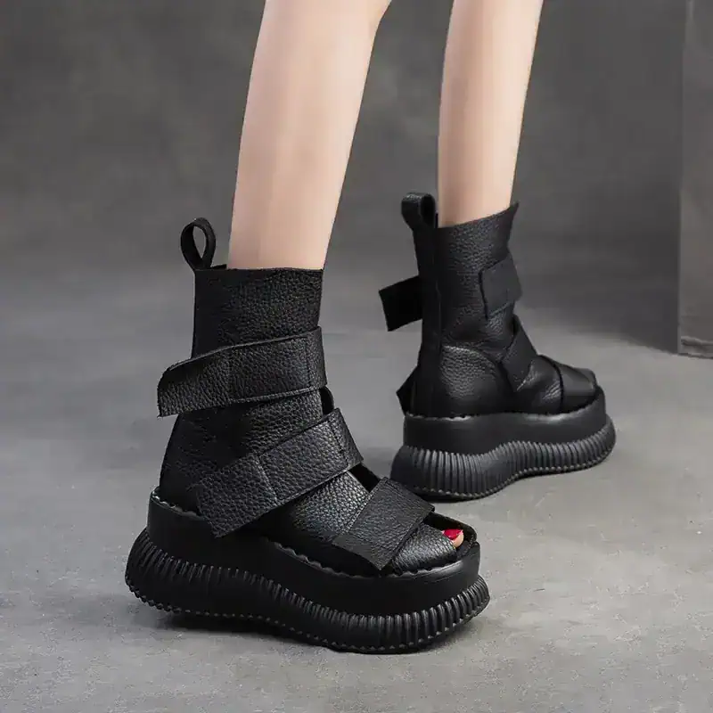 Black futuristic chunky platform boots with velcro straps and textured leather, stylish modern footwear for women and men, Monalisa Store fashion collection.
