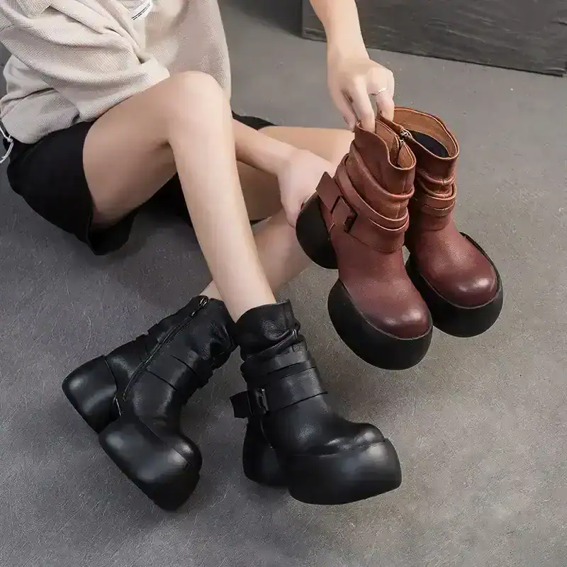Thick-soled platform boots, black and brown, displayed in a footwear store, perfect for fashion-forward individuals seeking unique, trendy footwear options.