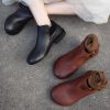 Black ankle boots for women with low chunky heels, stylish and comfortable footwear, perfect for casual or formal wear.
