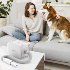 Gentle pet oxygen therapy device for dogs in a cozy home setting with a woman and her husky, promoting pet wellness and health through reliable respiratory support.