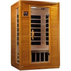 Sauna cabin with wooden interior and glass door for home wellness and relaxation.