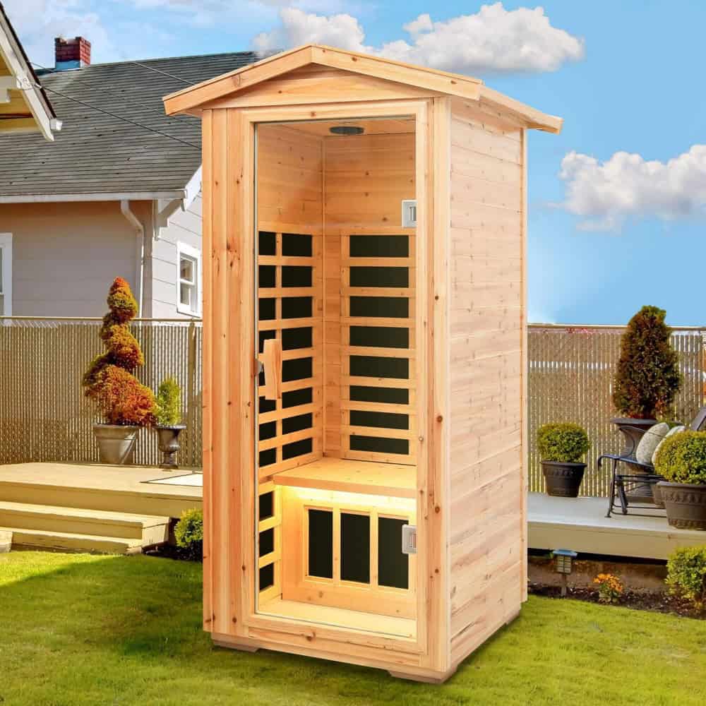 Shelving sauna cabin in a backyard with garden and outdoor furniture.