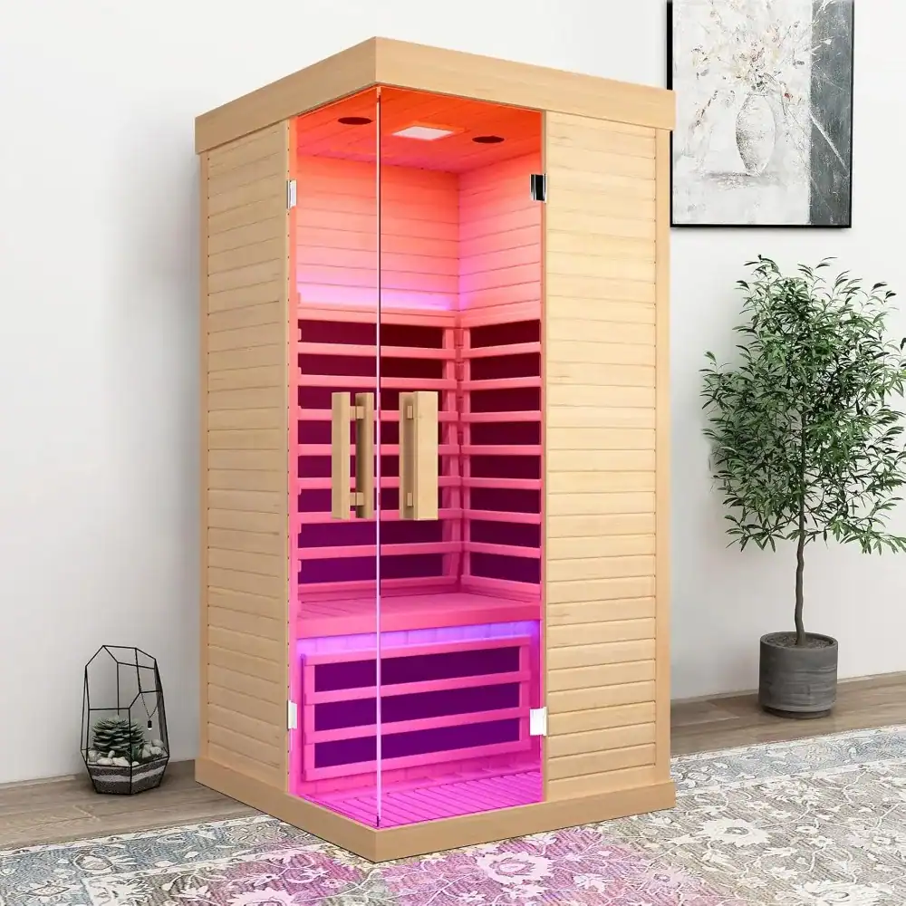 Sauna cabinet with pink LED lighting, wooden interior, glass doors, and handles, perfect for relaxing and wellness at Monalisa Medical Store.