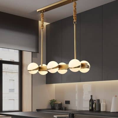 Modern stylish pendant light fixture with globe design hanging above kitchen counter at Monalisa Store for premium lighting solutions.