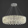 Chandelier with crystal accents hanging from a sleek ceiling mount, elegant lighting fixture for luxurious interior design. Perfect for enhancing sophisticated spaces and adding sparkle.