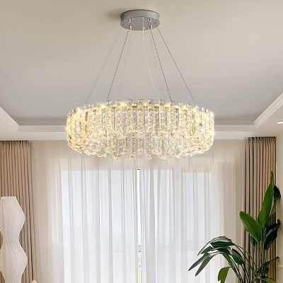 Luxurious crystal chandelier in a modern living room, featuring elegant lighting ideal for home interiors, enhanced by natural sunlight and stylish decor elements.