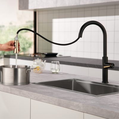 Sleek black kitchen faucet, modern kitchen sink with pull-down sprayer, minimalist kitchen design, high-arc kitchen tap, contemporary kitchen fixtures for stylish homes.