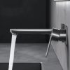 Modern stainless steel water faucet with a sleek design, mounted on a wall with water flowing into a sink, ideal for home or commercial kitchens, emphasizing durability and contemporary style.