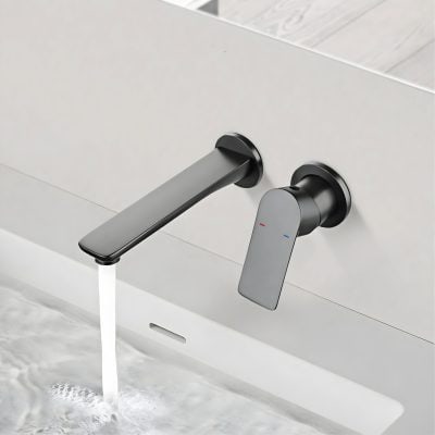 Sleek black and gray modern bathroom faucet with digital temperature controls, mounted on a white wall, with water flowing into a white sink, illustrating contemporary bathroom faucet design.