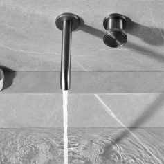 Modern stainless steel kitchen faucet with water flowing into sink, emphasizing sleek design and functionality.