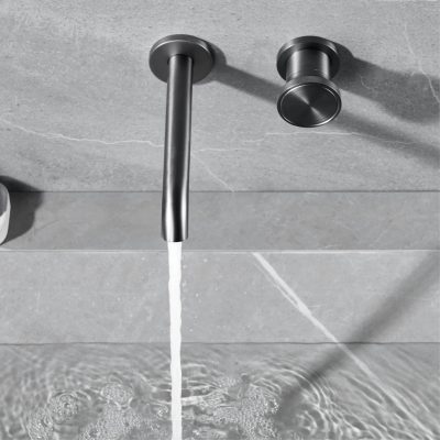 Modern stainless steel kitchen faucet with water flowing into sink, emphasizing sleek design and functionality.