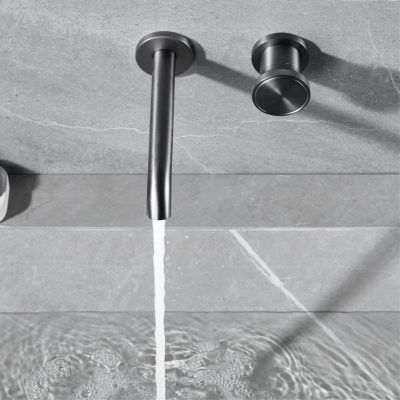 Sleek modern bathroom faucet with water flowing, stainless steel finish, minimalist design for contemporary bathroom decor.
