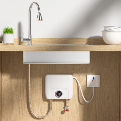 High-efficiency electric water heater installed under kitchen sink in modern home, compact design, energy-saving appliance for convenient hot water access.