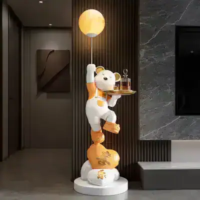 Monalisa Store modern indoor decor featuring playful bear sculpture holding a tray and illuminating moon lamp, perfect for stylish optometry or optical retail spaces.