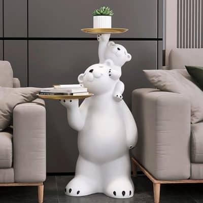 Whimsical bear-shaped side table with tray and plant on top, modern living room decor, eye-catching animal-inspired furniture for stylish home interior, perfect for enhancing cozy spaces.