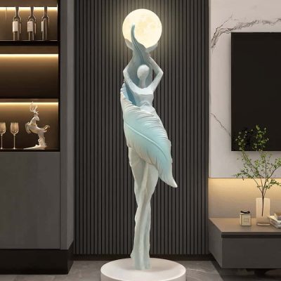 Elegant modern sculpture of a ballerina holding the moon, displayed in a sleek interior setting, perfect for enhancing the aesthetic of optometry clinics or eyewear stores like Monalisa Store.