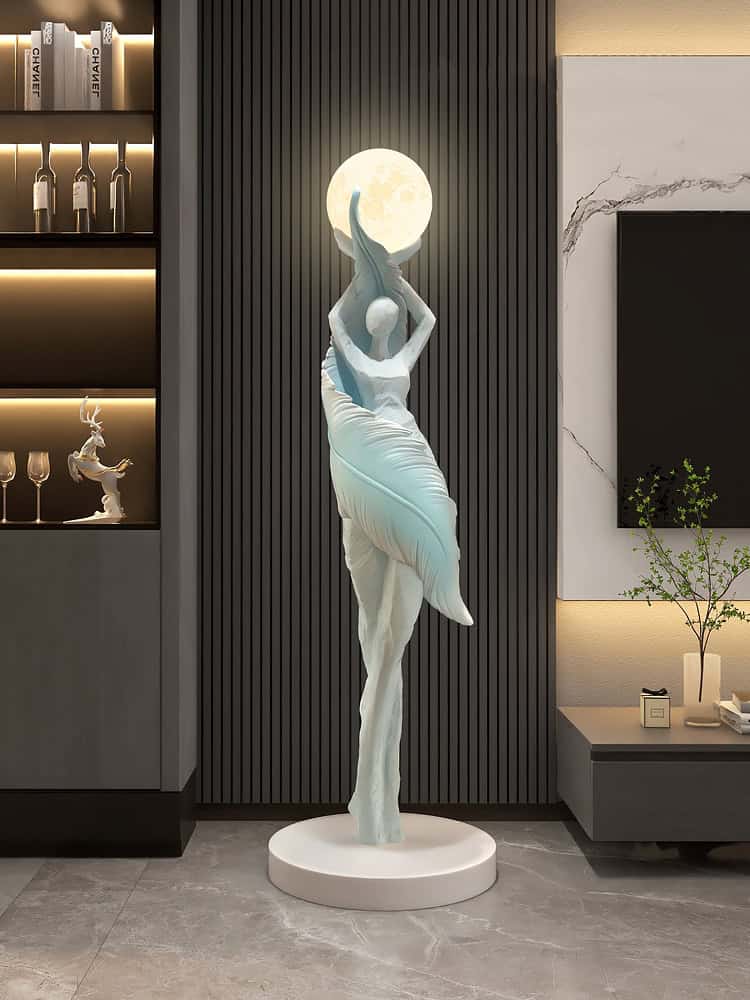 Elegant modern sculpture of a ballerina holding the moon, displayed in a sleek interior setting, perfect for enhancing the aesthetic of optometry clinics or eyewear stores like Monalisa Store.