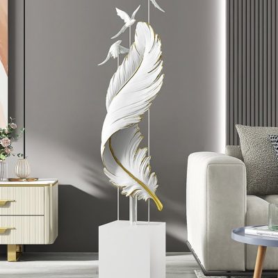 Elegant white feather sculpture with gold accents and flying bird details at Monalisa Medical Store, showcasing stylish modern decor for wellness and healthcare environments.