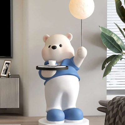 Cute bear statue holding a floating tray and a moon lamp in a modern living room, perfect for a cozy and stylish home decor. Ideal for enhancing interior design with playful and whimsical accents.
