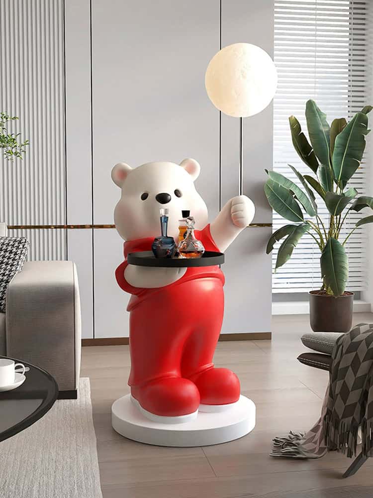 Vibrant teddy bear statue holding a tray of colorful bottles in modern interior, perfect for home decor, children's room, or themed space with a playful and artistic touch.