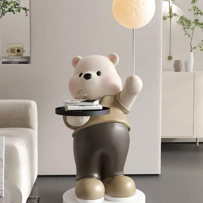 Cute bear-shaped lamp holding a moon-shaped light, modern interior decor, decorative figure, cozy home ambiance, Monalisa Medical store aesthetic, stylish living space, playful decor accent, contemporary design element, high-quality home furnishings, trendy interior accessories, home decoration ideas, minimalist decor, innovative lighting solutions.