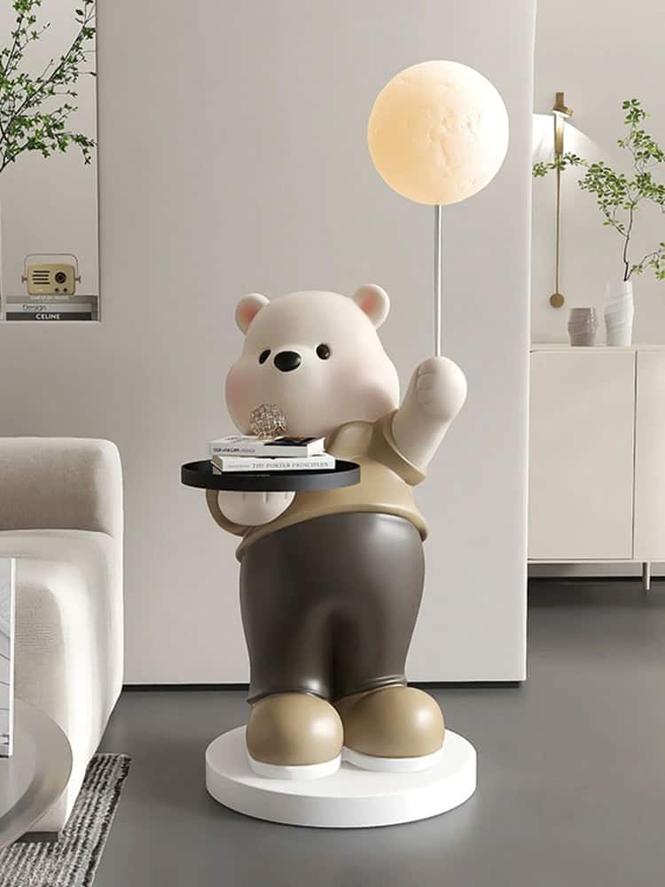 Cute bear-shaped lamp holding a moon-shaped light, modern interior decor, decorative figure, cozy home ambiance, Monalisa Medical store aesthetic, stylish living space, playful decor accent, contemporary design element, high-quality home furnishings, trendy interior accessories, home decoration ideas, minimalist decor, innovative lighting solutions.