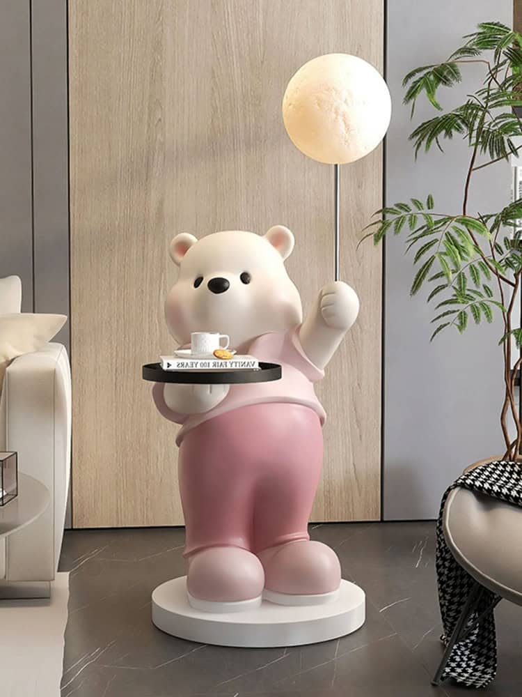 Cute bear statue holding a tray with a coffee cup at Monalisa Medical Store, modern interior design, decorative art piece, inviting atmosphere for healthcare and wellness products, eye-catching display.