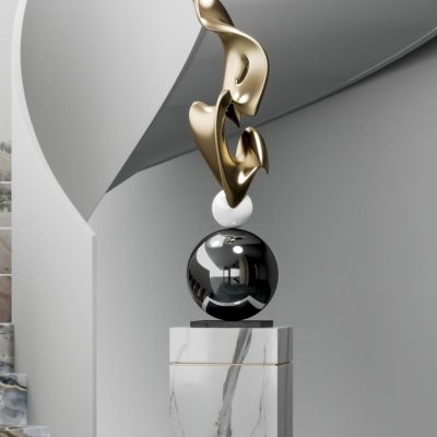 Elegant abstract sculpture with gold, white, and black elements displayed on a marble pedestal in a modern interior design setting. Perfect for enhancing dental clinic reception decor.