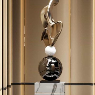 Elegant modern abstract sculpture display at Monalisa Medical Store, featuring metallic and marble elements, ideal for sophisticated interior décor and enhancing medical or aesthetic spaces.