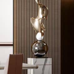 Elegant modern sculpture with gold and black finishes displayed in Monalisa Store interior. Perfect for upscale medical centers or luxury decor settings.